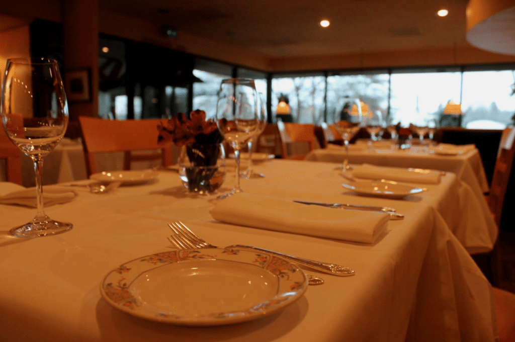 A table with plates and silverware on it