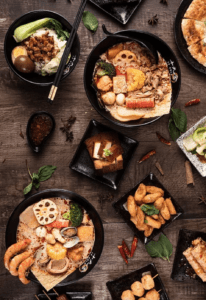 A table with bowls of food on it